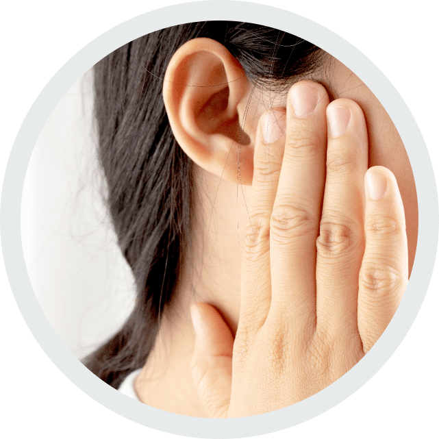 Woman grabbing her ear in pain