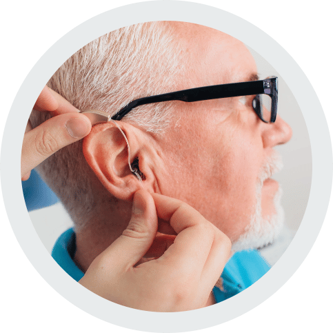 Man getting hearing aid fitting